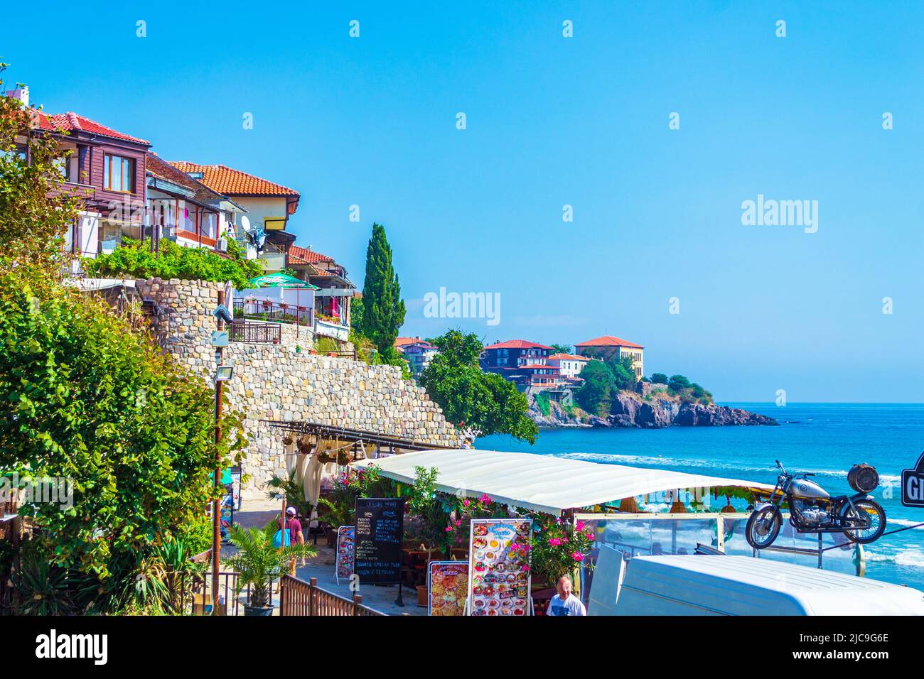 Traditional Wooden Houses And Ancient Fortification Stone Wall Black traditional-wooden-houses-and-ancient-fortification-stone-wall-black