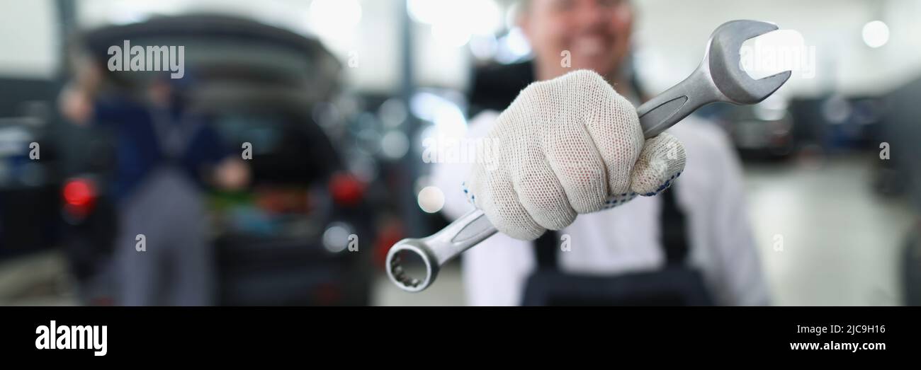 Car Service Machine Car maintenance service worker holding wrench equipment for work Stock ...