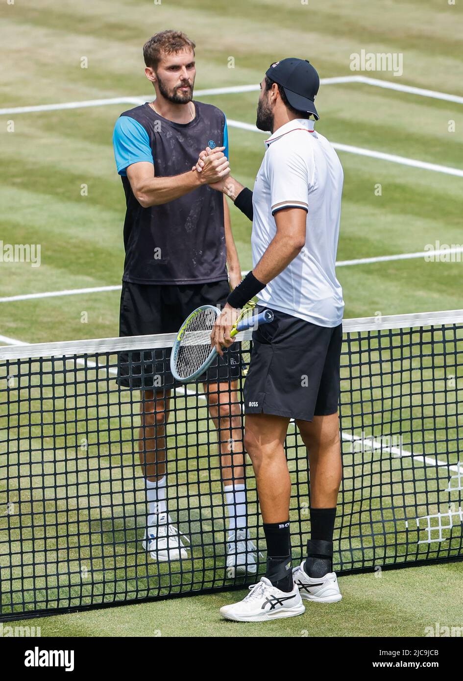 Stuttgart, Germany. 11th June, 2022. Oscar Otte (L) of Germany greets Matteo Berrettini of Italy after thier men's singles semifinal match at Boss Open 2022 in Stuttgart, Germany, June 11, 2022. Credit: Philippe Ruiz/Xinhua/Alamy Live News Stock Photo