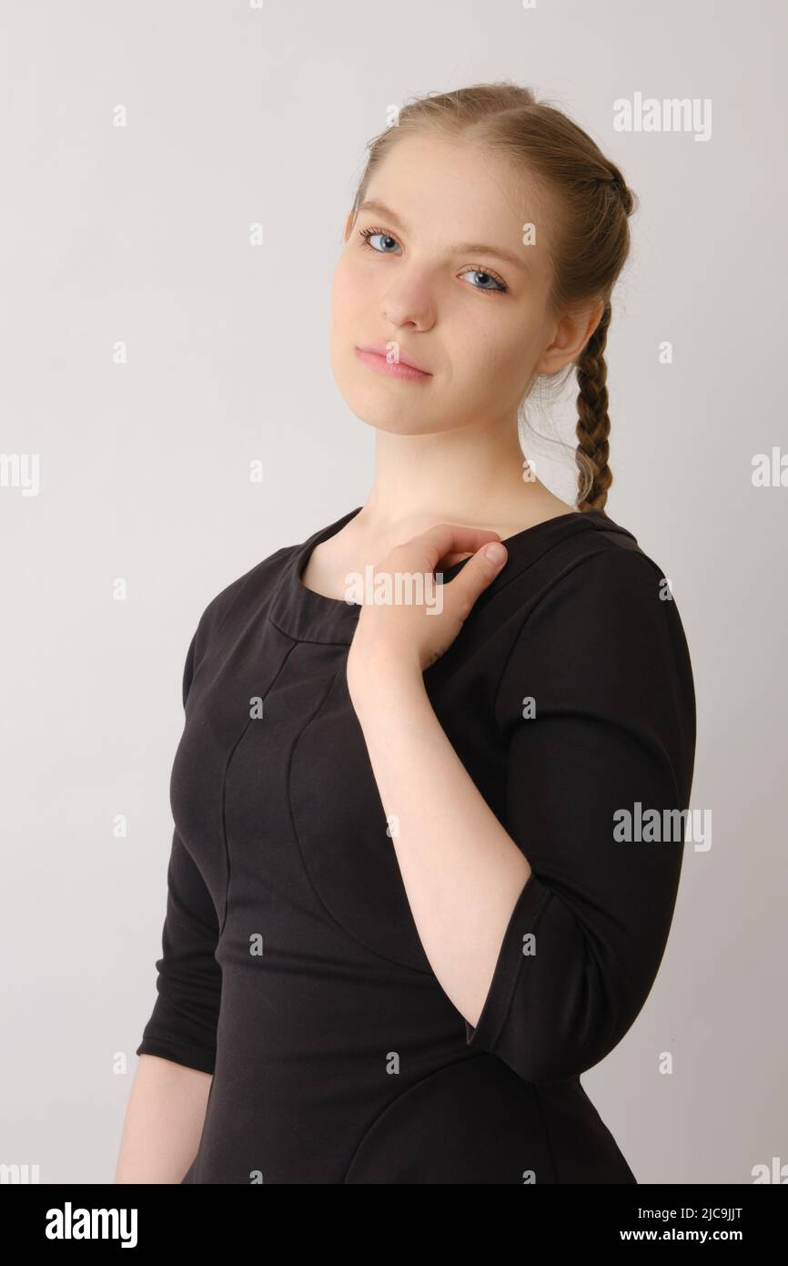 Plus size fashion model in black dress, fat woman on white background, body positive concept Stock Photo