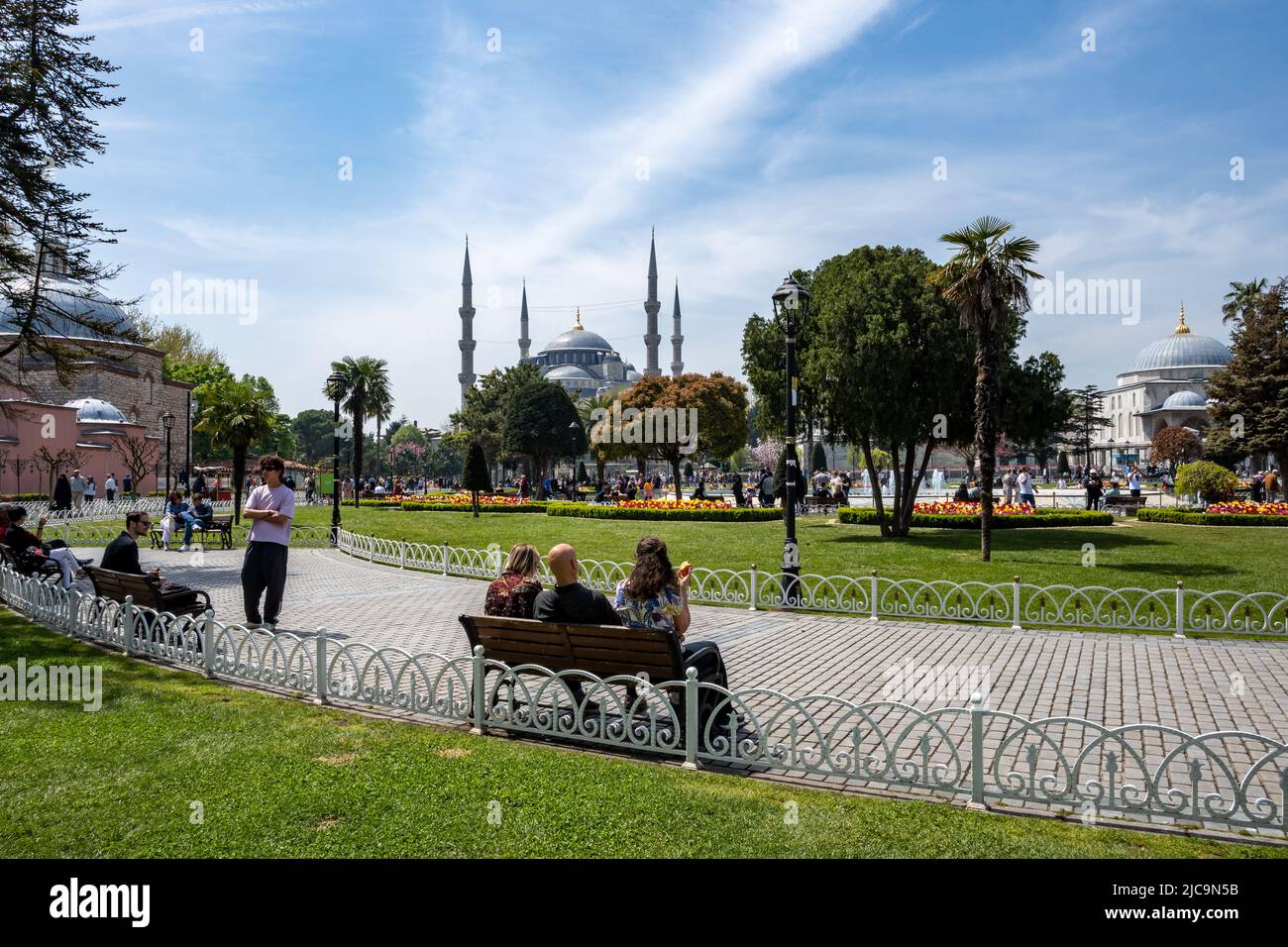 Tourists enjoy a beautiful day at Sultan Ahmet Park, Istanbul, Türkiye. Stock Photo