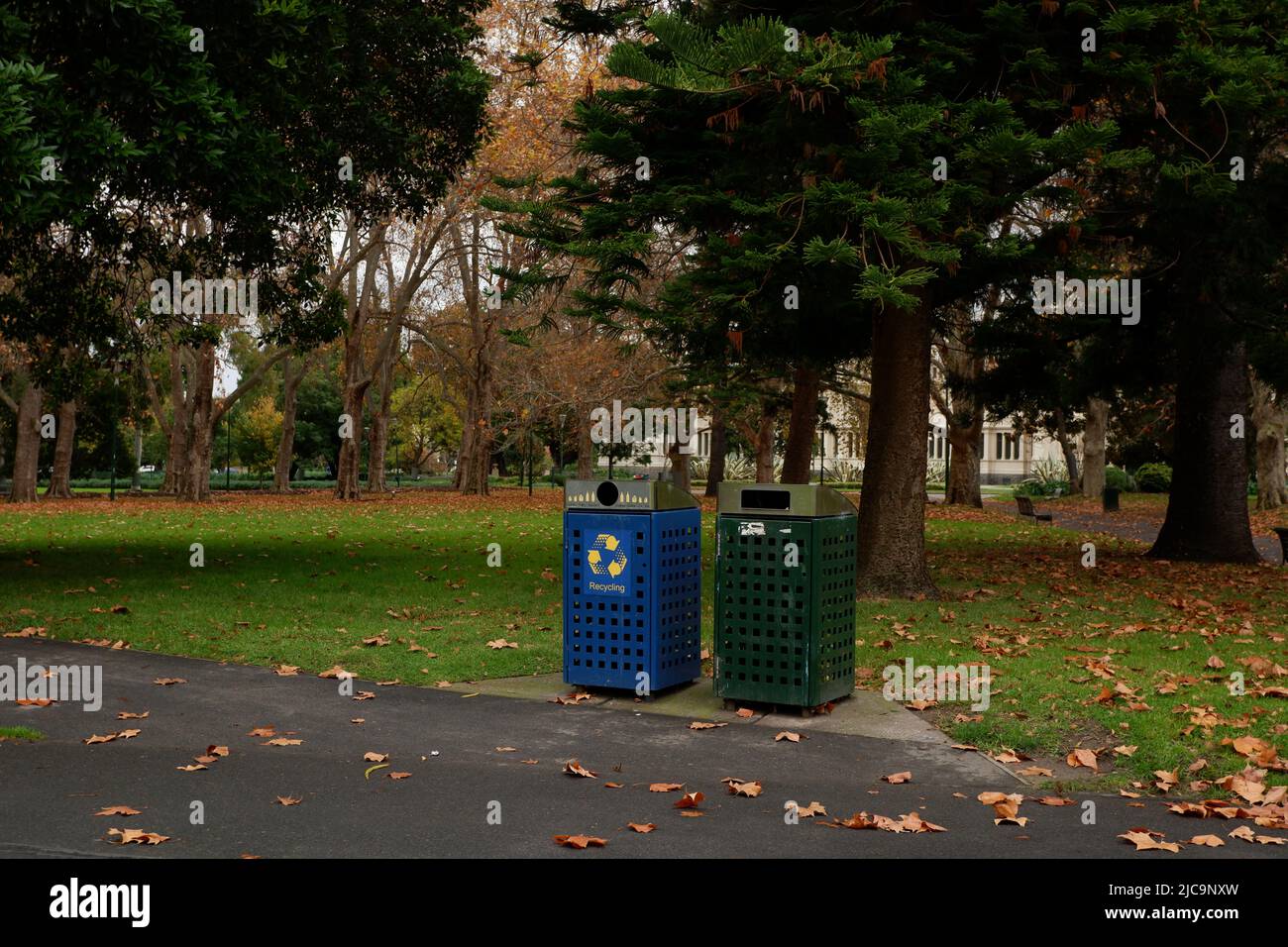 MELBOURNE, AUSTRALIA - 31 May 2022: Recycle bin and rubbish bin in the Carlton Garden, a Landscaped Victorian-era park Stock Photo