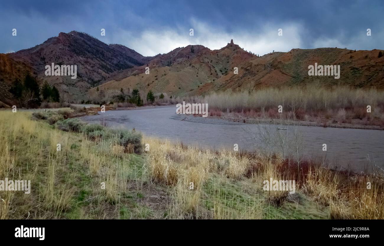 Mountain river with muddy water, melting snow in the mountains