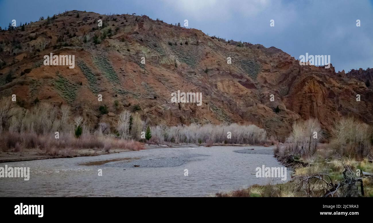 Mountain river with muddy water, melting snow in the mountains