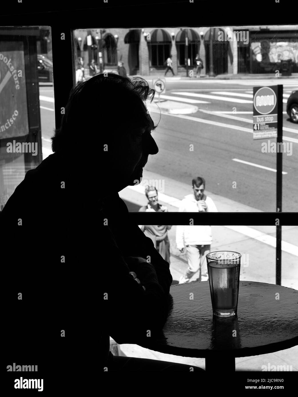 A man enjoys a pint of beer  at Vesuvio Cafe, a landmark bar in San Francisco, California, frequented by members of the 1950s Beat Generation. Stock Photo