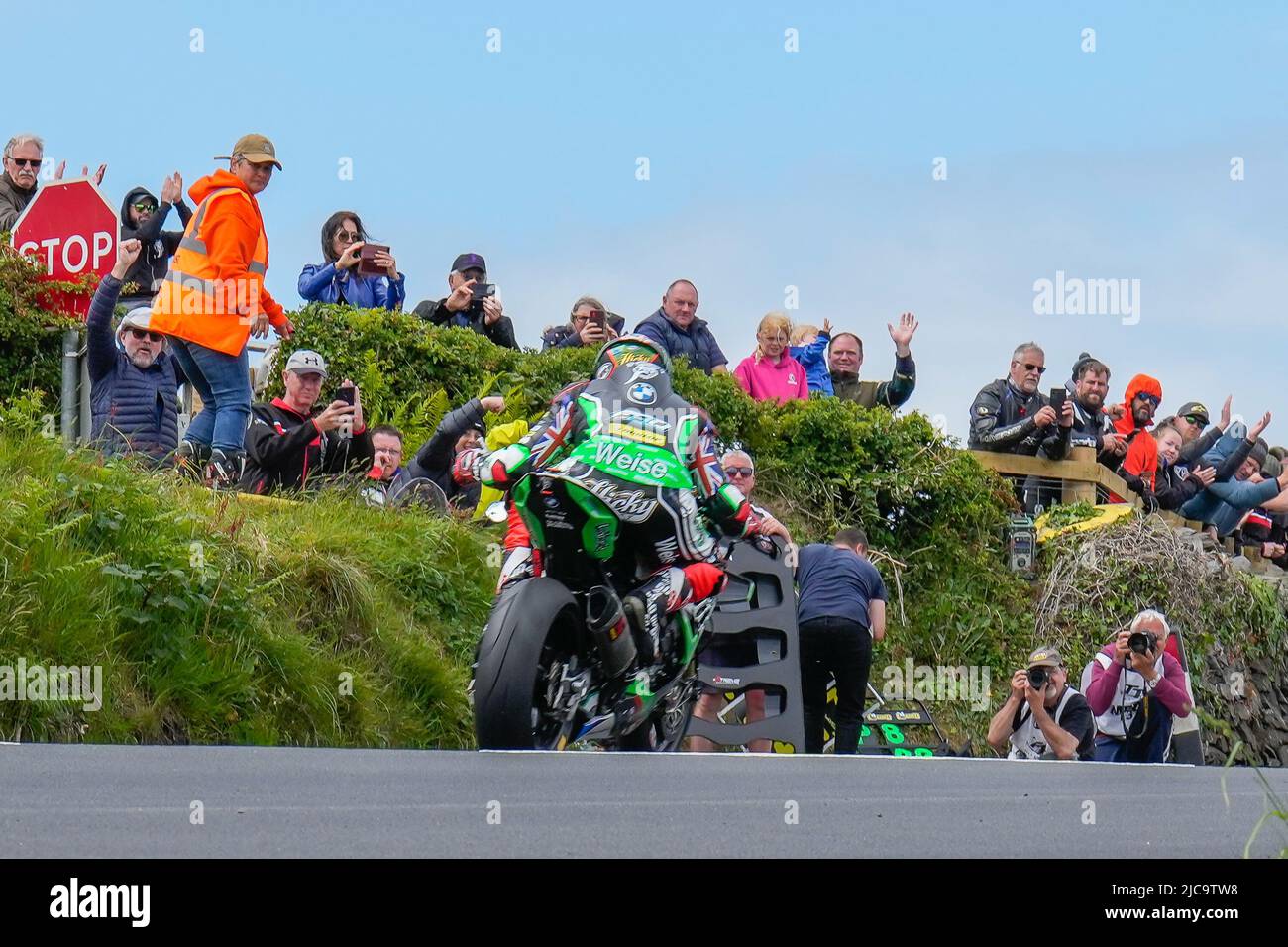 Douglas, Isle Of Man. 11th June, 2022. Peter Hickman (1000 BMW) representing the Gas Monkey Garage by FHO Racing team waves to fans in the last lap of the 2022 Milwaukee Senior TT at the Isle of Man, Douglas, Isle of Man on the 11 June 2022. Photo by David Horn. Credit: PRiME Media Images/Alamy Live News Stock Photo