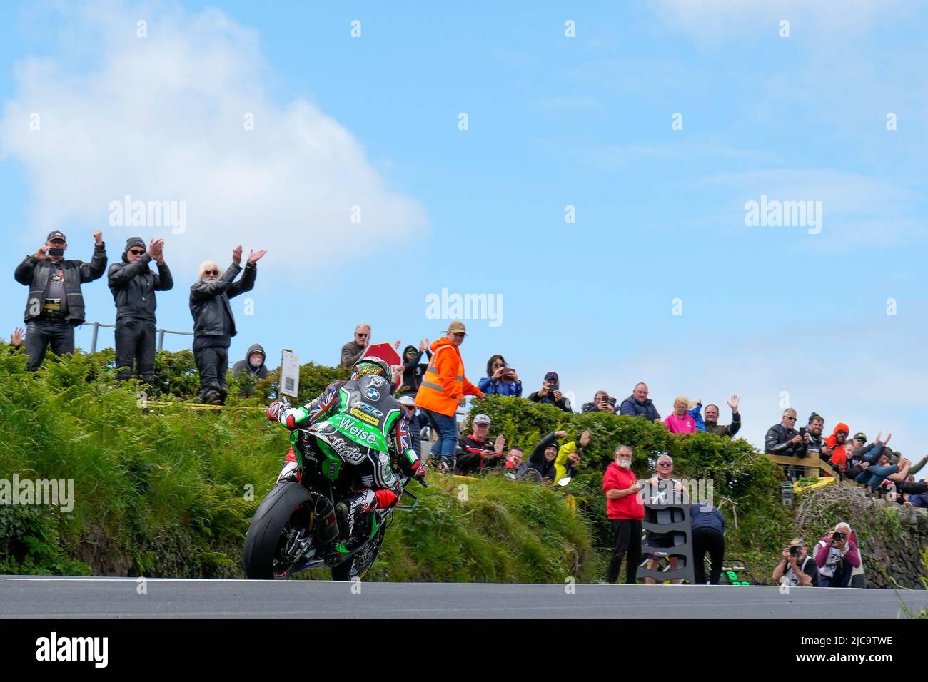 Douglas, Isle Of Man. 11th June, 2022. Peter Hickman (1000 BMW) representing the Gas Monkey Garage by FHO Racing team waves to fans in the last lap of the 2022 Milwaukee Senior TT at the Isle of Man, Douglas, Isle of Man on the 11 June 2022. Photo by David Horn. Credit: PRiME Media Images/Alamy Live News Stock Photo