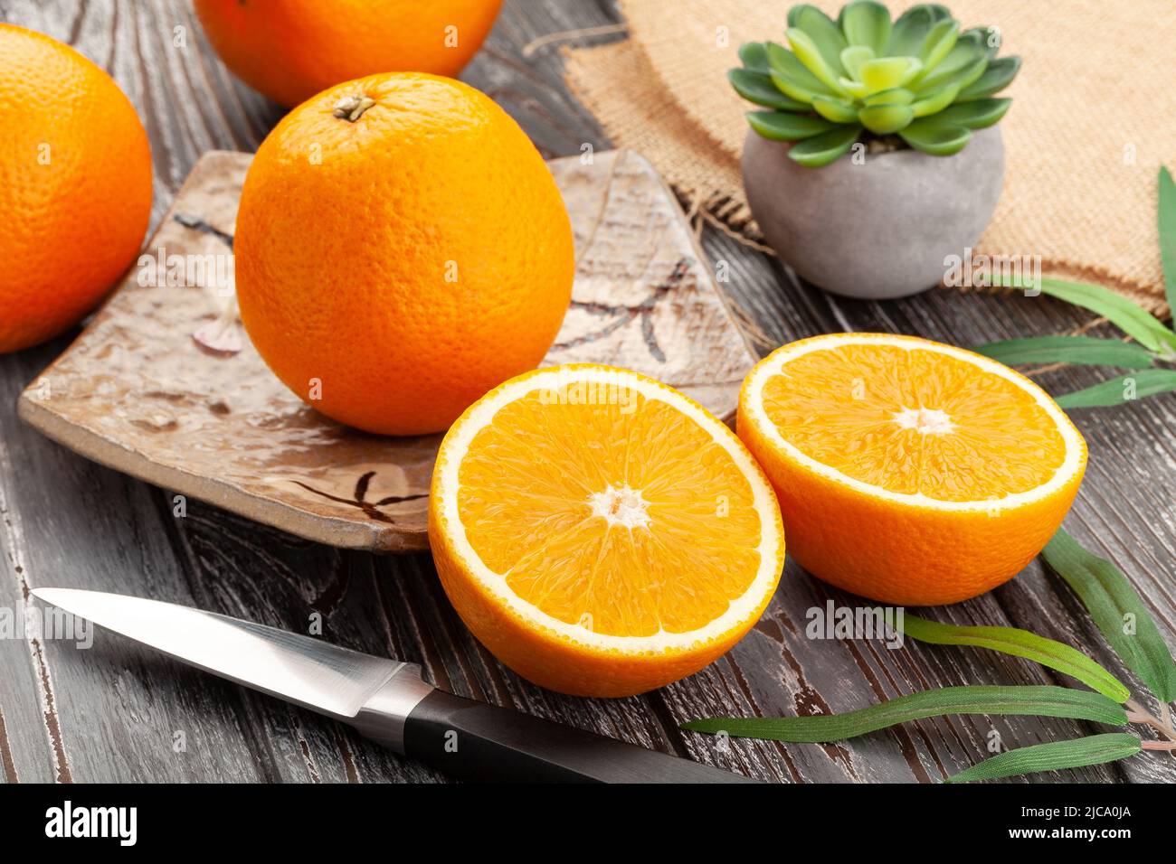 sliced oranges on wood background Stock Photo