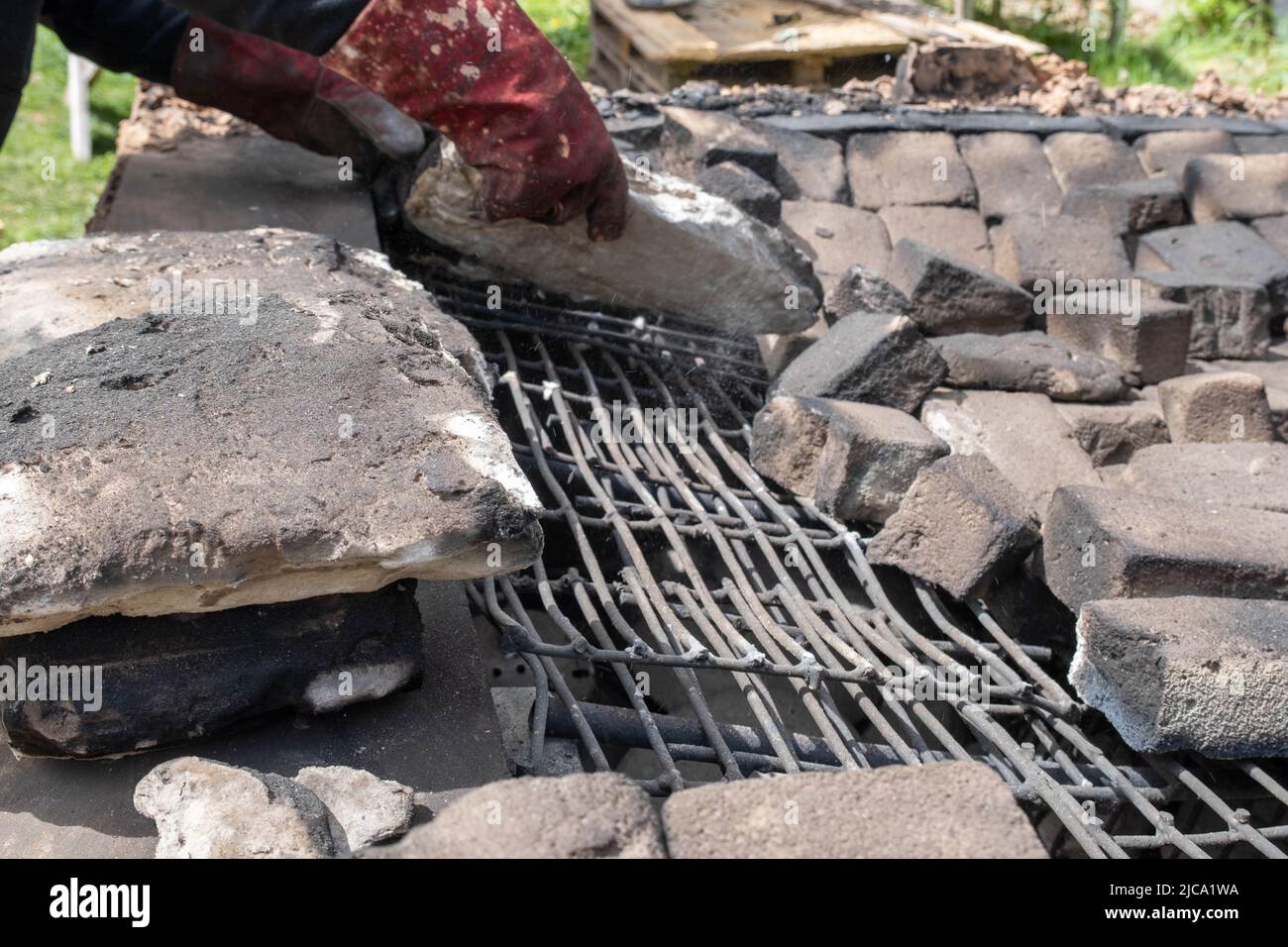 opening of a ceramic kiln, Unique handmade pots and dishes of clay