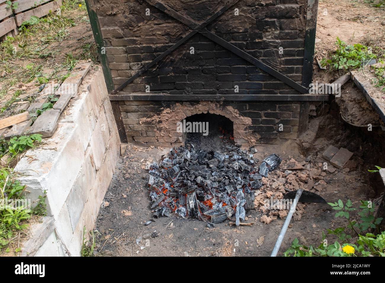 opening of a ceramic kiln, Unique handmade pots and dishes of clay