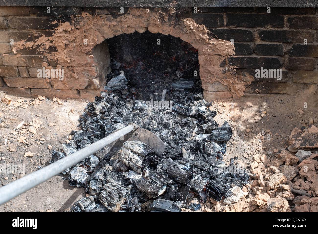 opening of a ceramic kiln, Unique handmade pots and dishes of clay