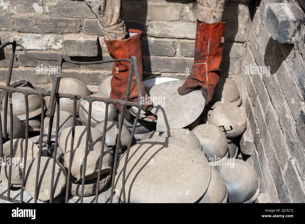 opening of a ceramic kiln, Unique handmade pots and dishes of clay ...