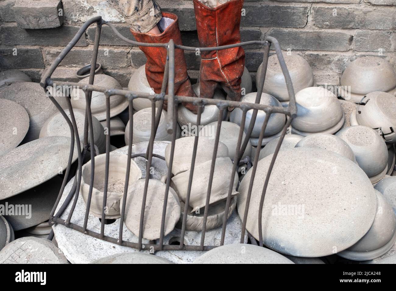 opening of a ceramic kiln, Unique handmade pots and dishes of clay