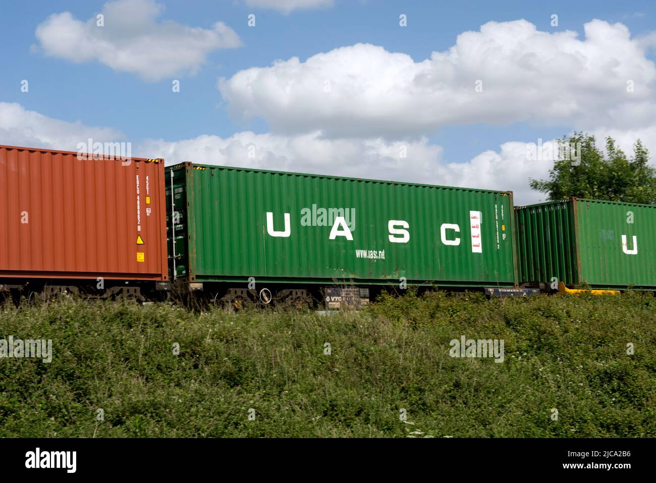 UASC shipping container on a freightliner train, Warwickshire, UK Stock Photo