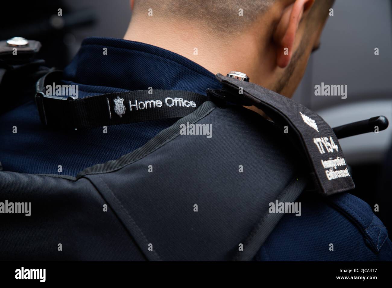 London, UK. 11th June 2022. Immigration oficers look on during ...