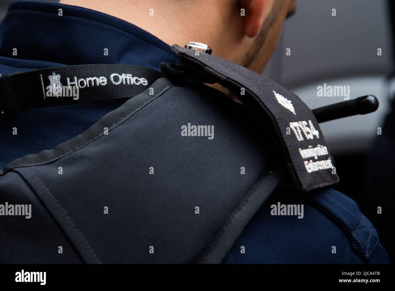 London, UK. 11th June 2022. Immigration oficers look on during ...
