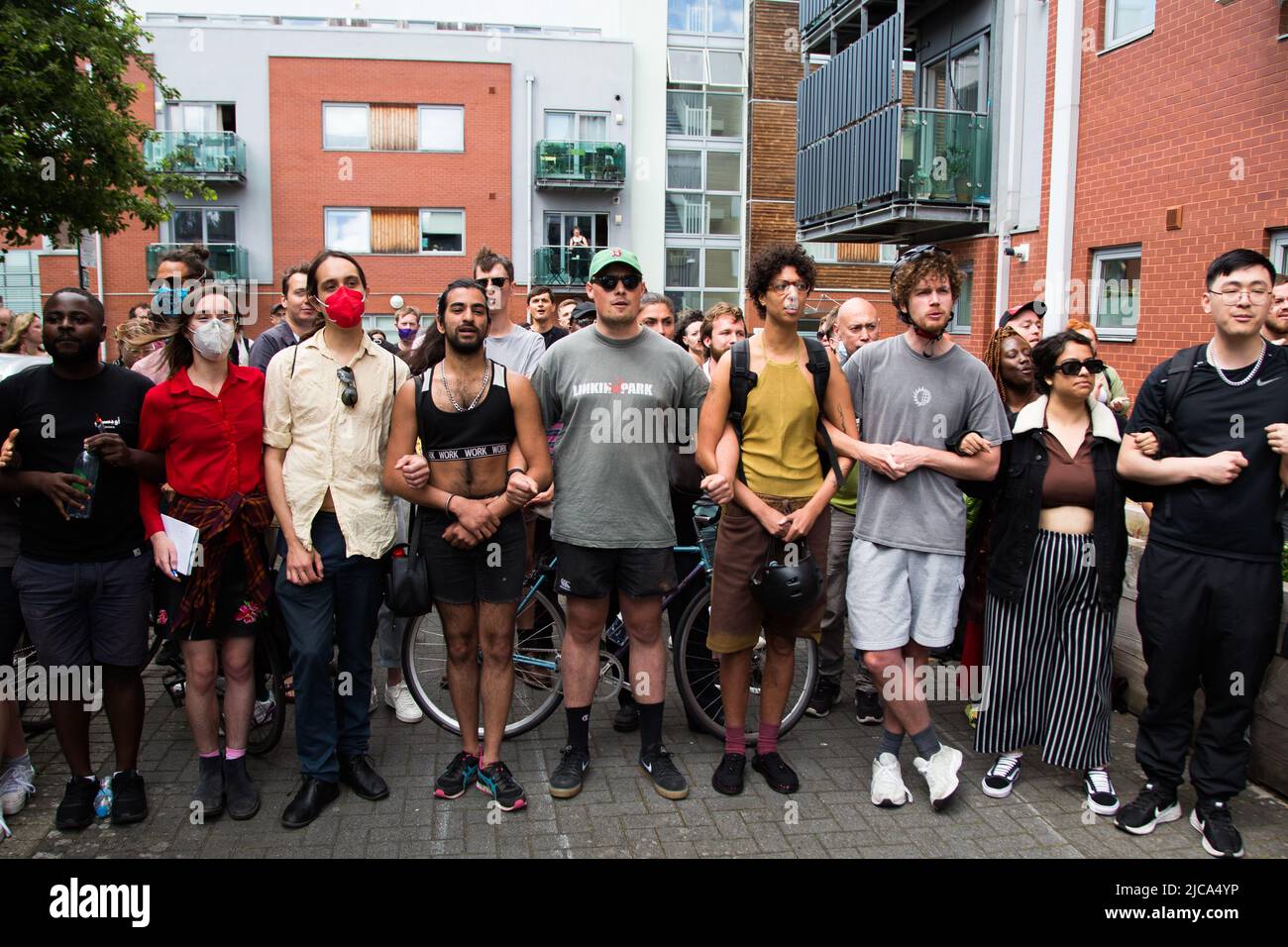 London, UK. 11th June 2022. People stand in front of a immigration van ...