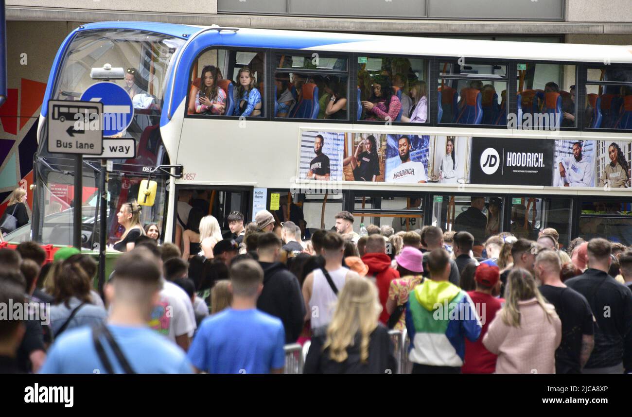 Manchester, UK. 11th June, 2022. Some 80,000 music fans head to Parklife festival, Heaton Park, Manchester, England, United Kingdom, for the two day event. Fans on their way to travel from the city centre by bus or tram. The two day admission tickets, now sold out, were £137. Credit: Terry Waller/Alamy Live News Stock Photo