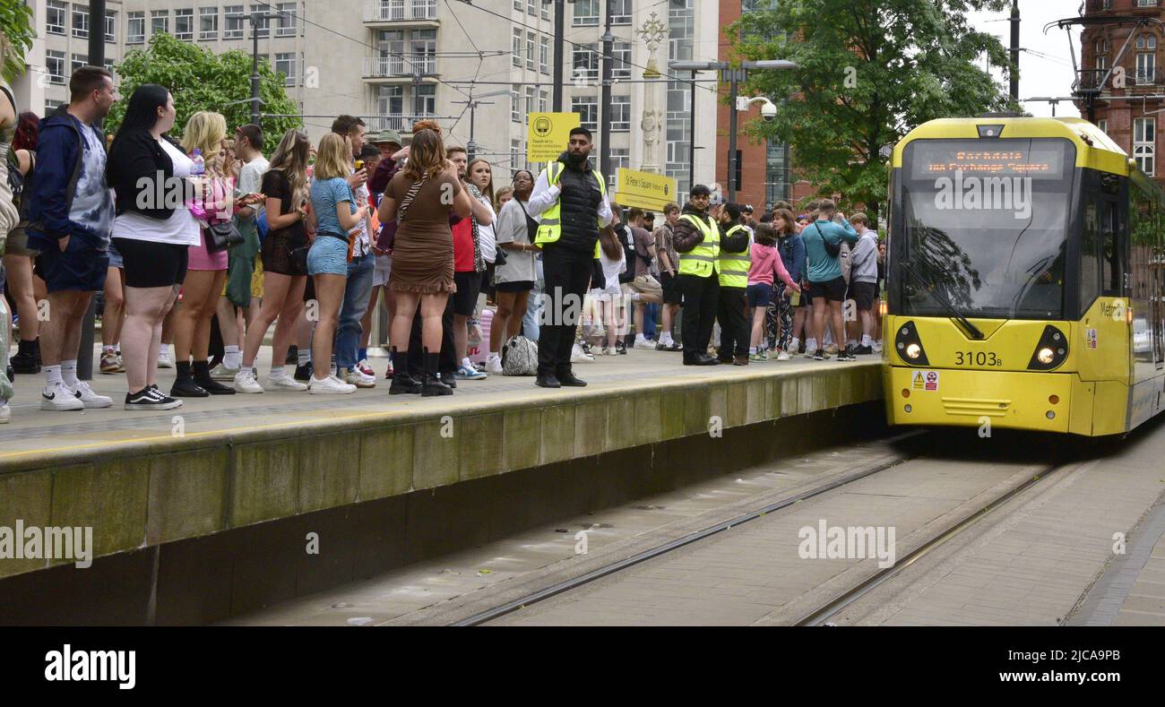 Manchester, UK. 11th June, 2022. Some 80,000 music fans head to Parklife festival, Heaton Park, Manchester, England, United Kingdom, for the two day event. Fans on their way to travel from the city centre by bus or tram. The advertised performers include: Tyler, The Creator, Megan Thee Stallion, Loyle Carner, Bicep, Chase & Status, and Central Cee. The two day admission tickets, now sold out, were £137. Credit: Terry Waller/Alamy Live News Stock Photo