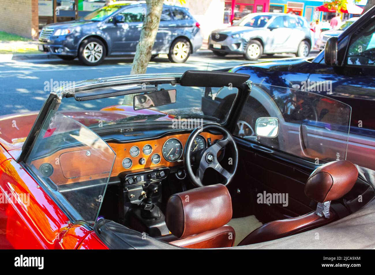 interior of red convertible jaguar  designed of left side driving parked on street on Bribie Island Queensland Australia circa 9-2015 Stock Photo