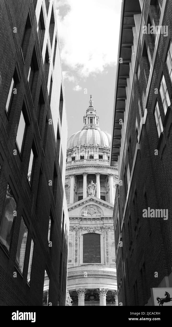 London, Greater London, England, June 08 2022: Monochrome. Looking a narrow road towards St Pauls Cathedral. Stock Photo