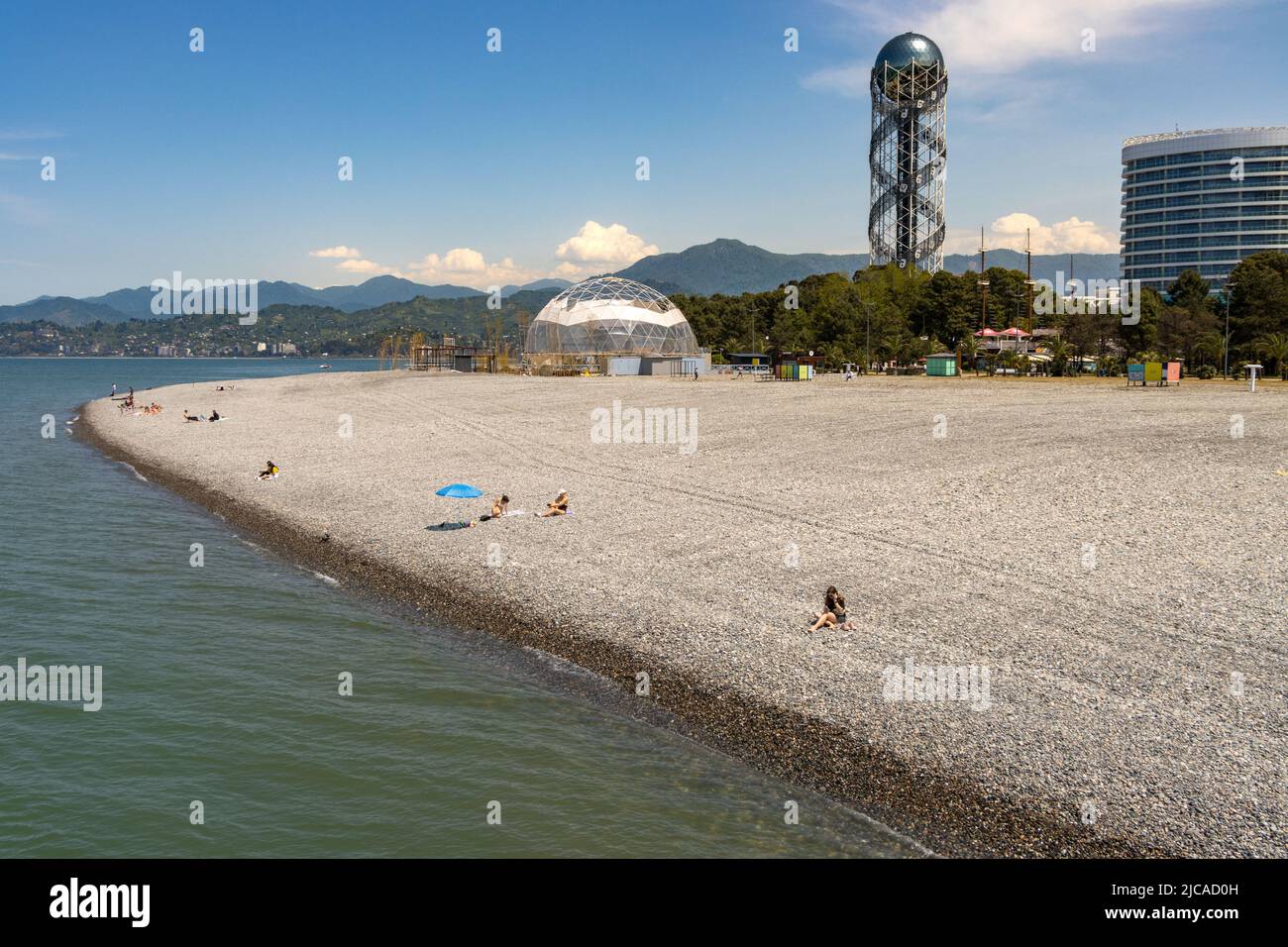 Batumi, Georgia - May 15 2022: People sunbathing on the beach of batumi on a sunny summer day Stock Photo