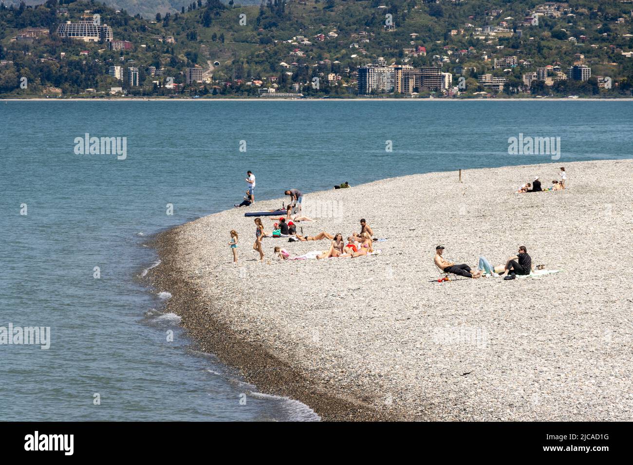 Batumi, Georgia - May 15 2022: People sunbathing on the beach of batumi on a sunny summer day Stock Photo