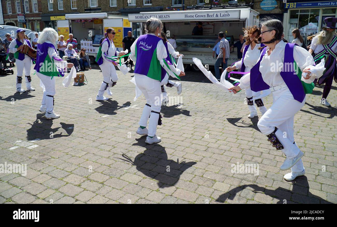 The Black Annis Morris dancing ladies in action in market place. Stock Photo
