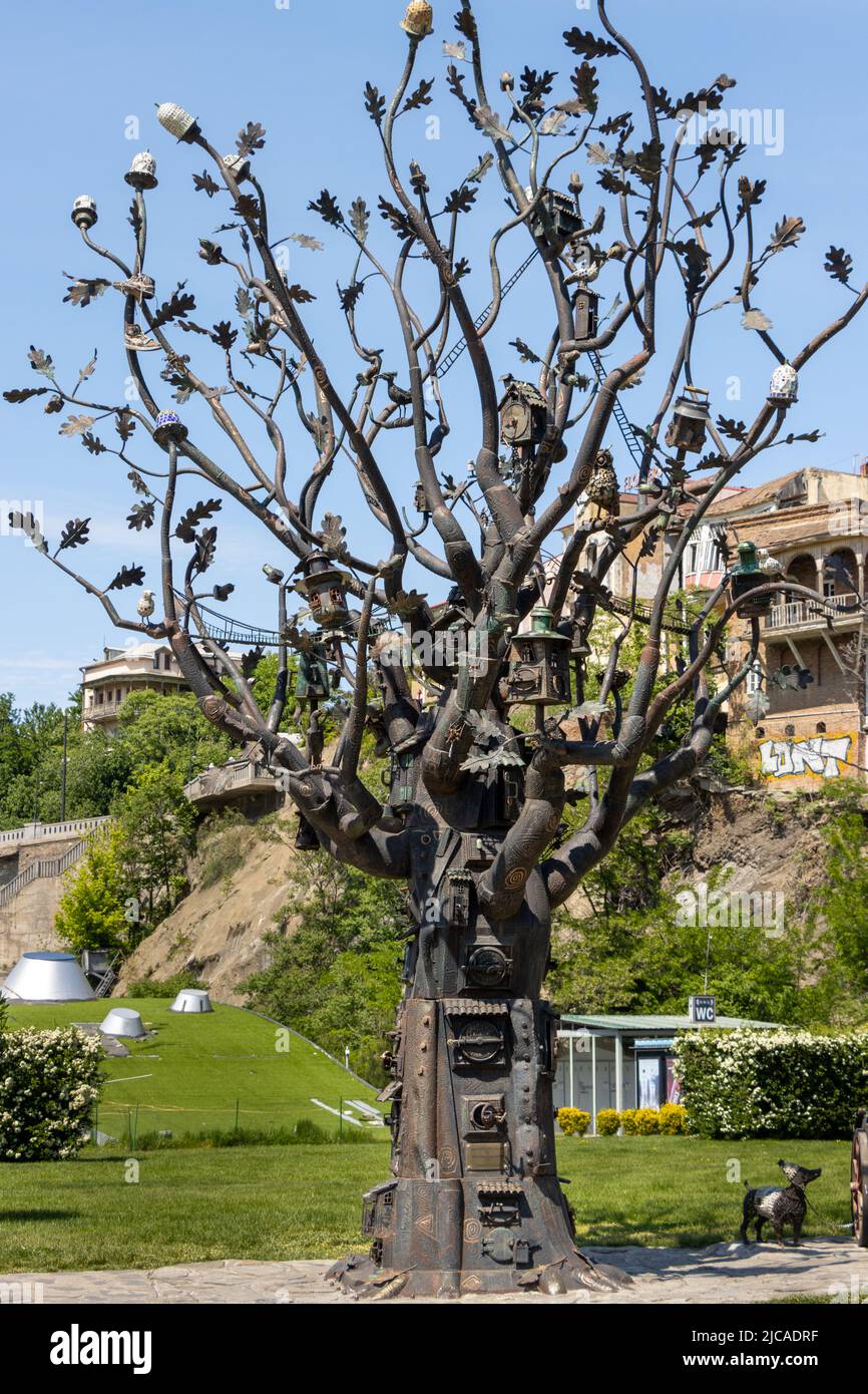 Tbilisi, Georgia - May 17 2022: Iron tree statue in Tbilisi Rike Park Stock Photo