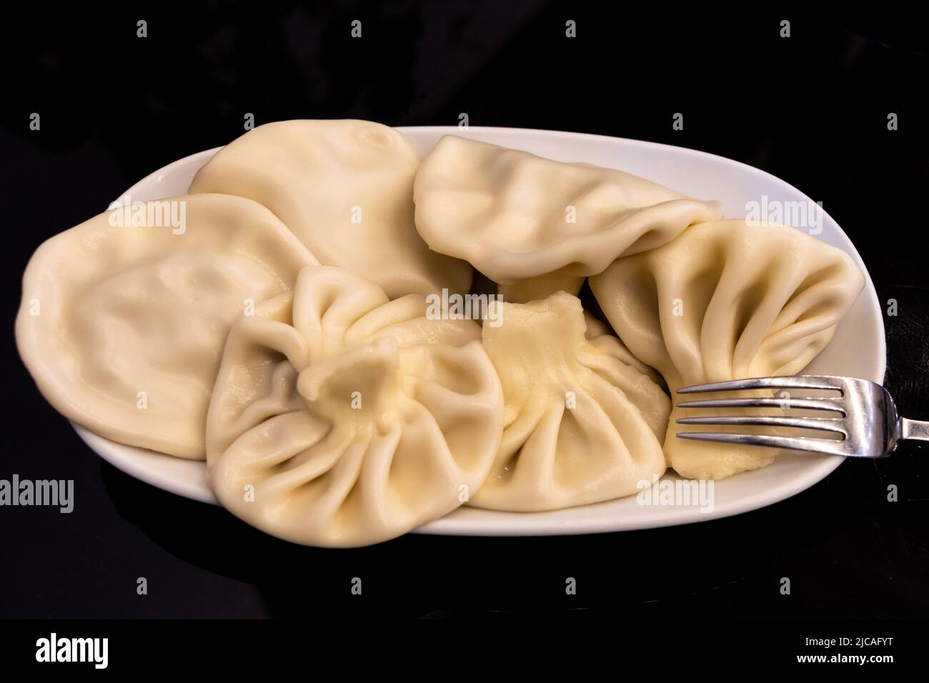 Georgian and Caucasian traditional dumplings; Khinkali food Stock Photo