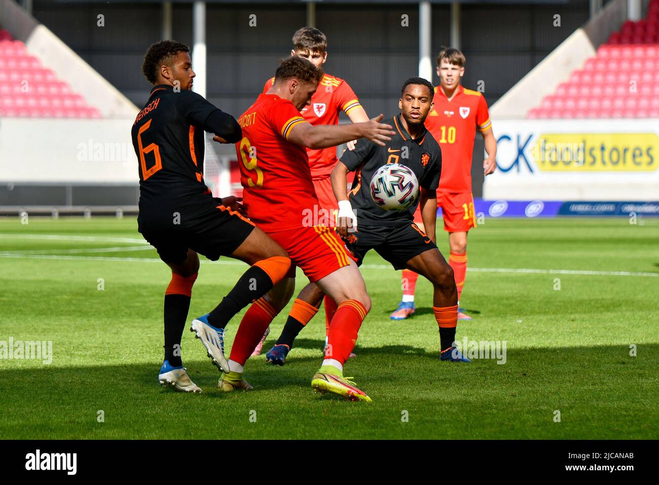 Llanelli, Wales. 11 June, 2022. Luke Jephcott of Wales U21 shields the ball from Devyne Rensch of Netherlands U21 during the UEFA European Under-21 Championship Qualifier Group E match between between Wales U21 and Netherlands U21 at Parc y Scarlets in Llanelli, Wales, UK on 11, June 2022. Credit: Duncan Thomas/Majestic Media. Stock Photo