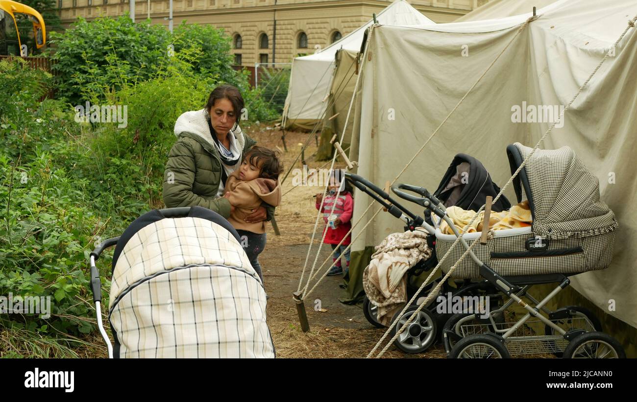 Immigrants refugees Ukraine detention Gypsies Gypsy camp people family children stroller child Roma mother placement in Brno Ukrainian train station Stock Photo