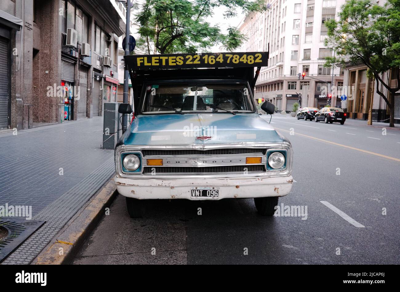 Buenos Aires, Argentina - January, 2020: Front view of old 70s Chevrolet CK10 pickup in classic blue color with radiator grille that says Chevrolet Stock Photo