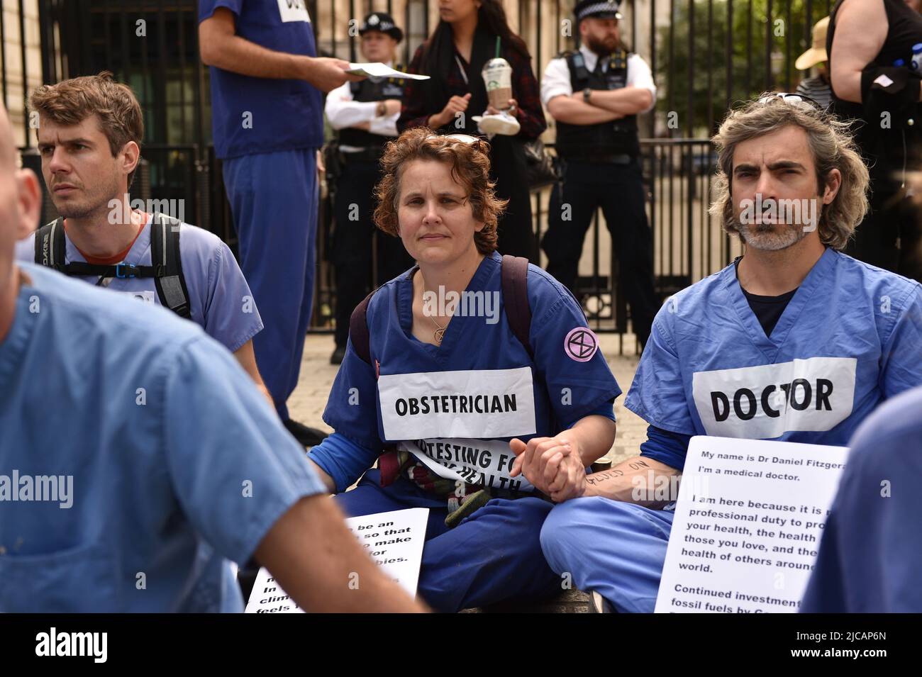 Extinction Rebellion doctors, nurses and other health professionals gathered for a protest in Westminster to demand an end to fossil fuel investments. Stock Photo