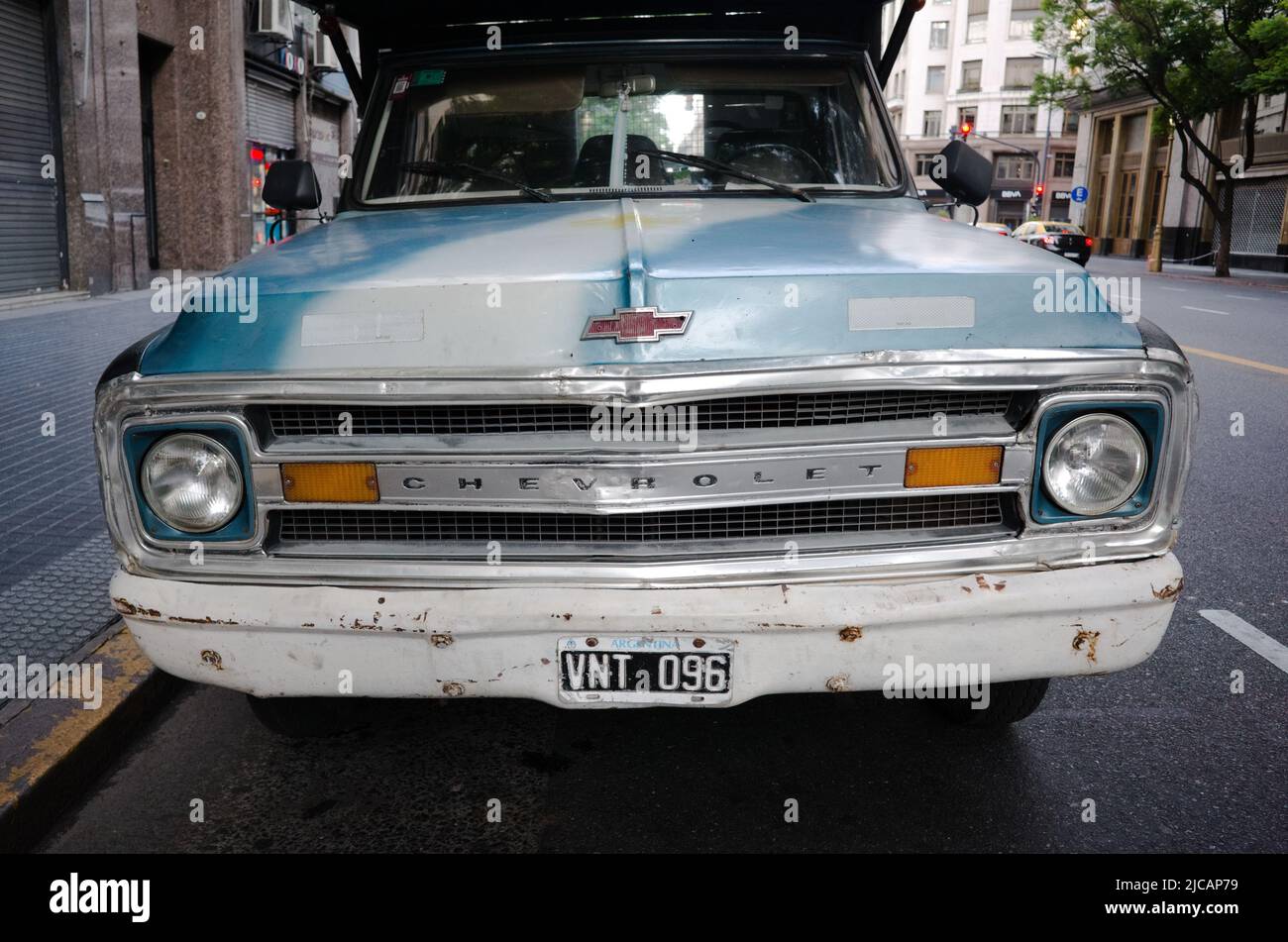 Buenos Aires, Argentina - January, 2020: Front view of old 70s Chevrolet C K 10 pickup in classic blue color with radiator grille that says Chevrolet Stock Photo
