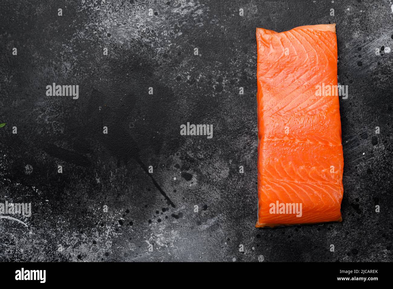 Raw Fillet of salmon, on black dark stone table background, top view ...
