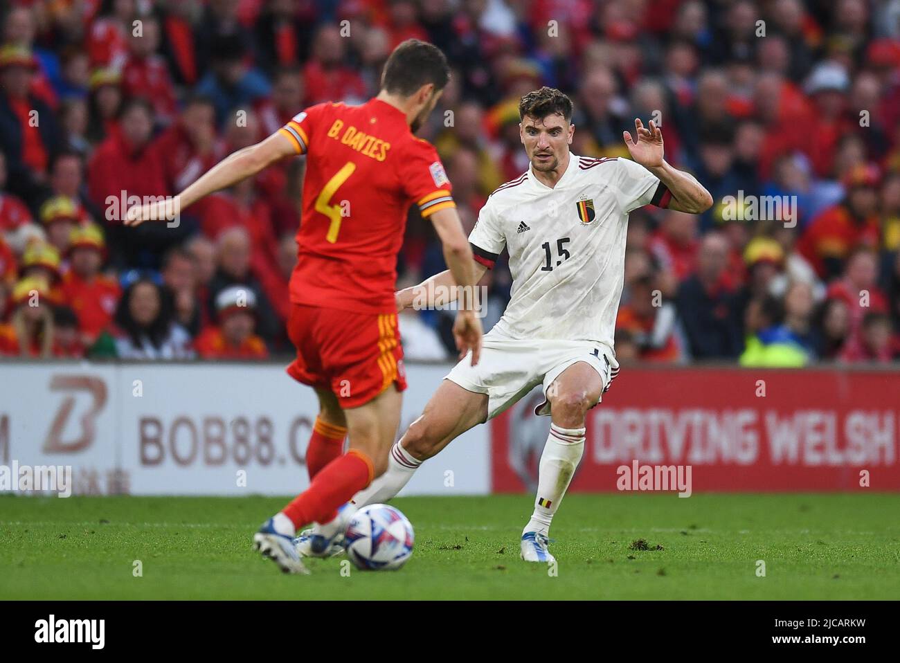 Cardiff, UK. 11th June, 2022. Ben Davies of Wales, tackled by Thomas Meunier of Belgium, Credit: News Images /Alamy Live News Stock Photo