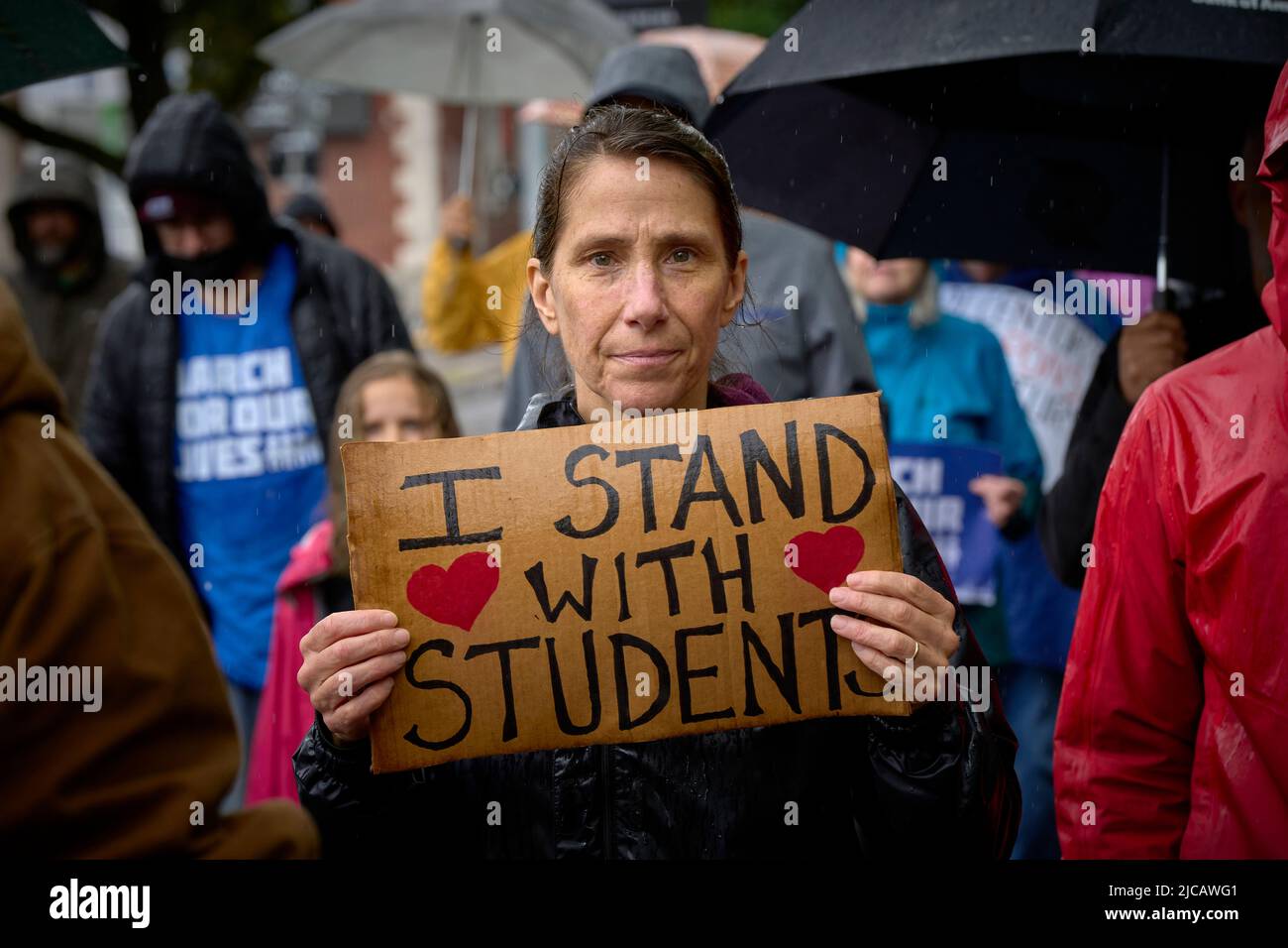 A participant carries a sign in a June 11, 2022, March for our Lives in Eugene, Oregon, USA. The marchers, angered by a spate of recent mass shootings Stock Photo