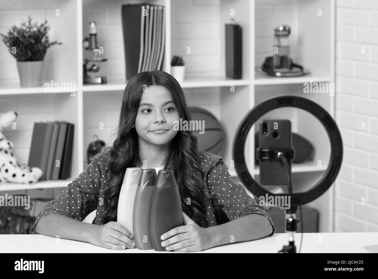 kid beauty blogger. child presenting cosmetic product for teen. vlogger