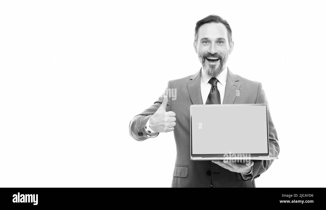 happy businessman presenting laptop for copy space copy space show thumb up, product proposal. Stock Photo