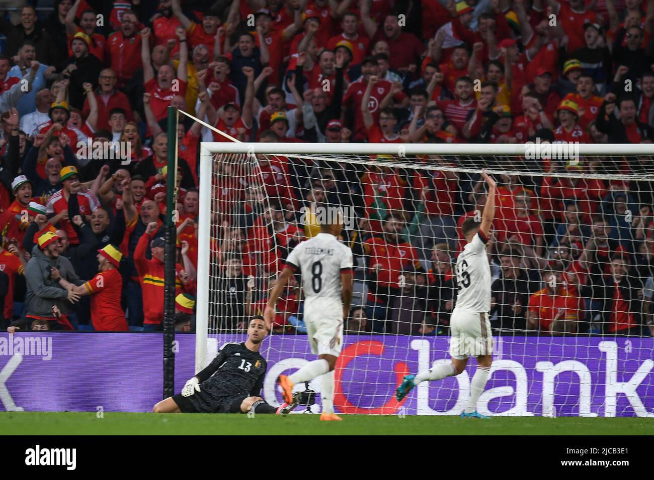 Cardiff, UK. 11th June, 2022. Brennan Johnson of Wales, scores past goalkeeper, Koen Casteels of Belgium, to make it 1-1 Credit: News Images /Alamy Live News Stock Photo