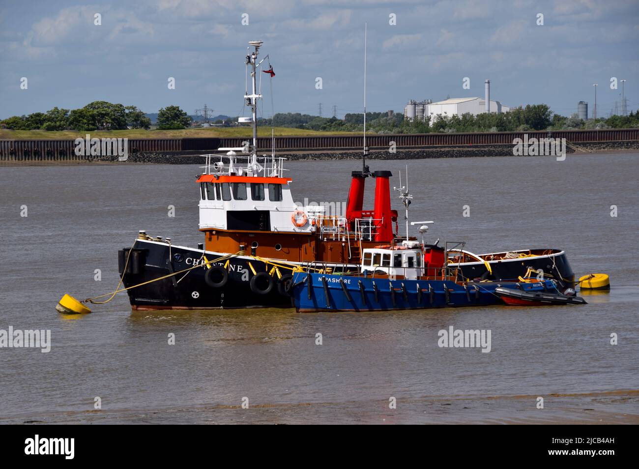 11/06/2022 Gravesend UK Tug boats Christine and humorously named Nipashore moored in the River Thames near Gravesend. Stock Photo