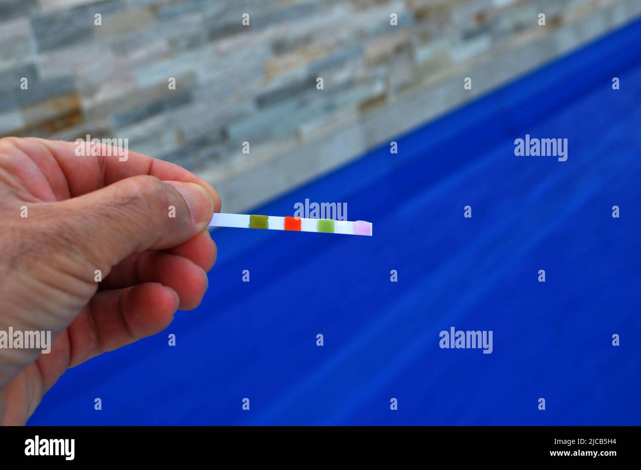 Swimming pool chemical testing strip Stock Photo Alamy
