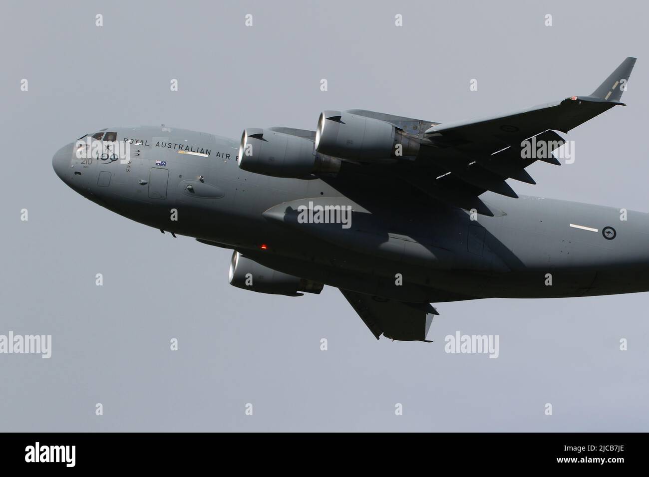 A41-210, a Boeing C-17 Globemaster III operated by the Royal Australian Air Force (RAAF), wearing markings to celebrate the force's centenial anniversary, departing from Prestwick International Airport in Ayrshire, Scotland, on a flight to Poland. Stock Photo