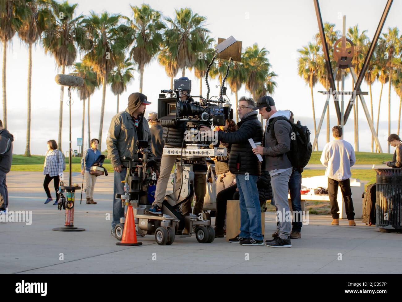 Professional Hollywood movie set has camera crew and actors preparing for scene before filming on location in Los Angeles Stock Photo