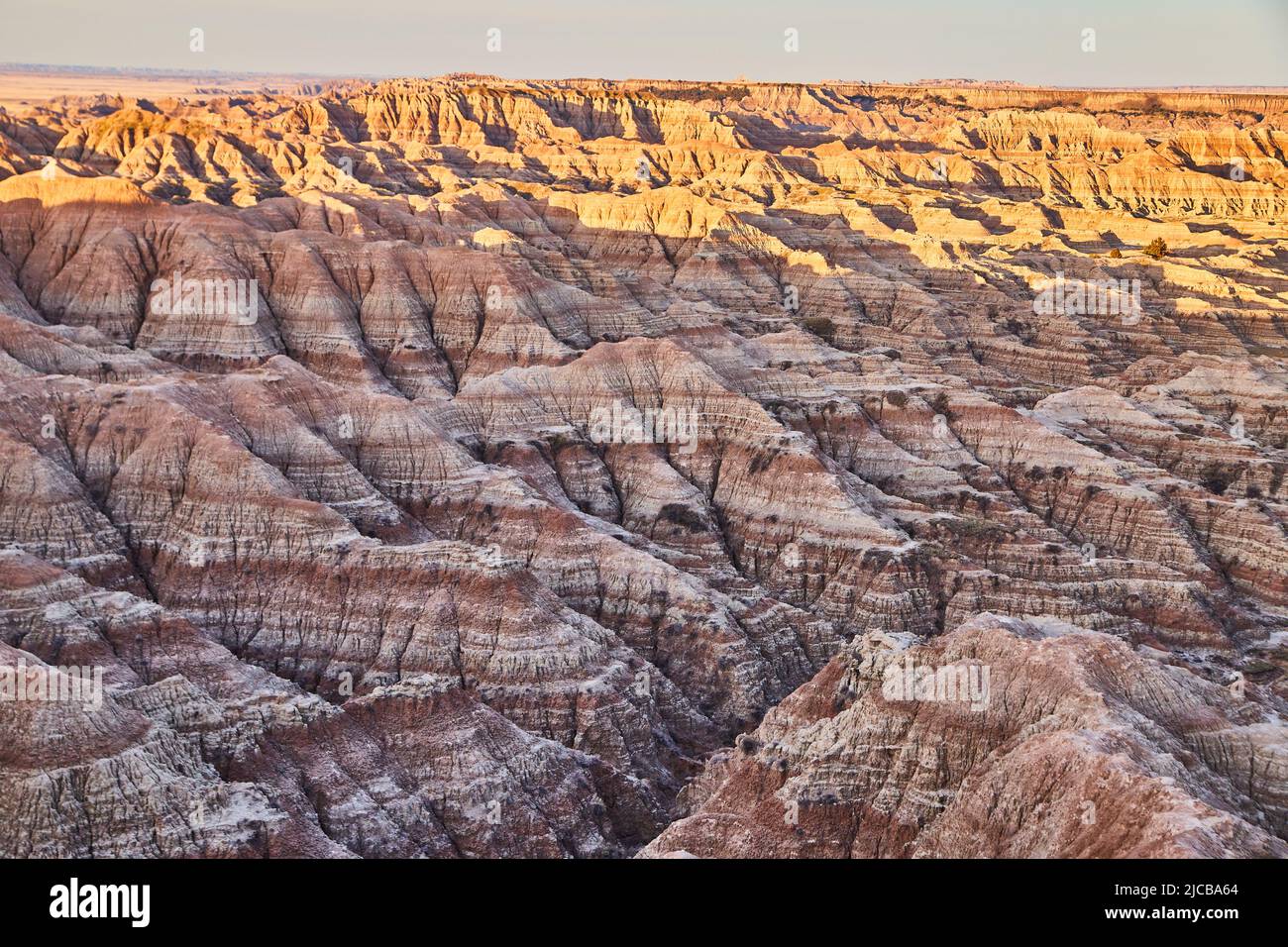 Layers of sediment layers in Badlands of South Dakota with sunrise Stock Photo