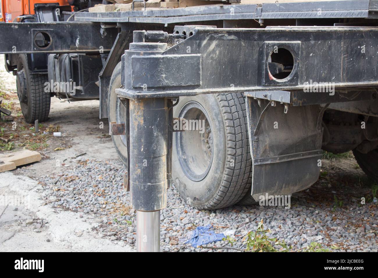 Heavy duty steel crane outrigger pad in construction site Stock Photo