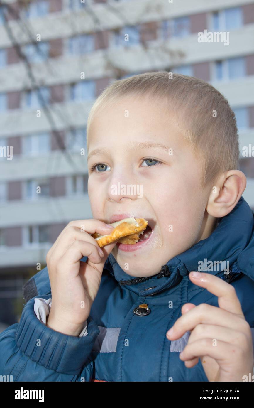 pasties to eat outdoors on the background apartment buildings Stock Photo