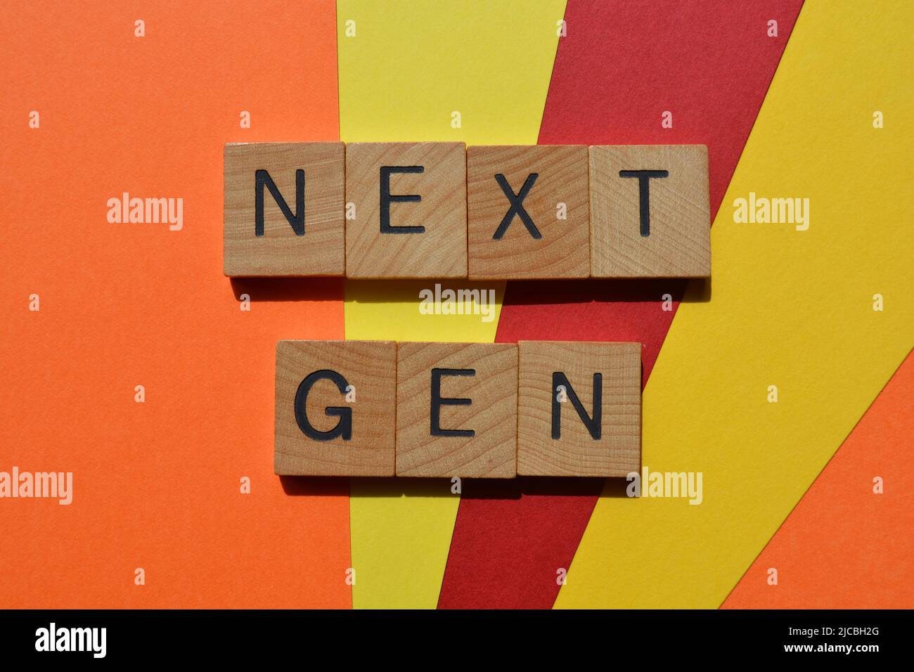 Next Gen, words in wooden alphabet letters isolated on bright and colourful background Stock Photo