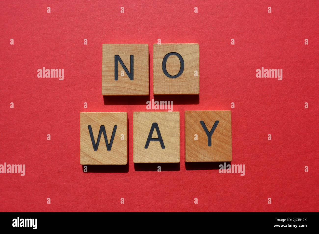 No Way, words in wooden alphabet letters isolated on bright red background Stock Photo